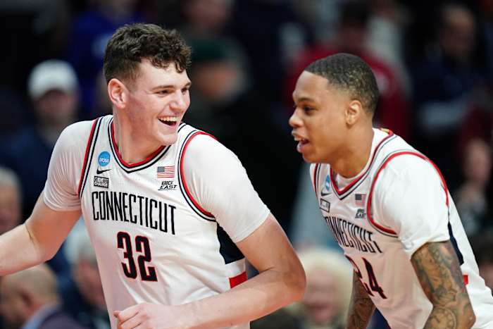 UConn players celebrate advancing to the Sweet 16.